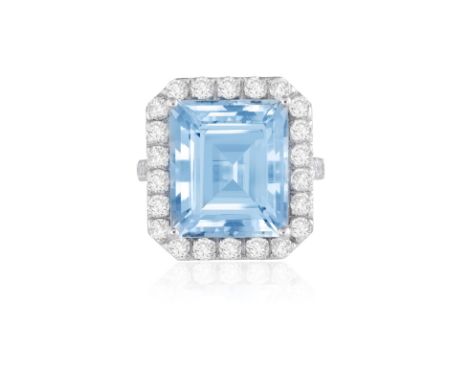 AN AQUAMARINE AND DIAMOND DRESS RINGThe rectangular-cut aquamarine weighing 10.56cts, within a brilliant-cut diamond surround