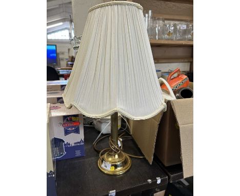 A brass based standard lamp and a hanging planter