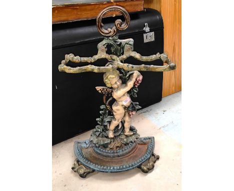 A 19th century cast iron stick stand with cherub and vine decoration 