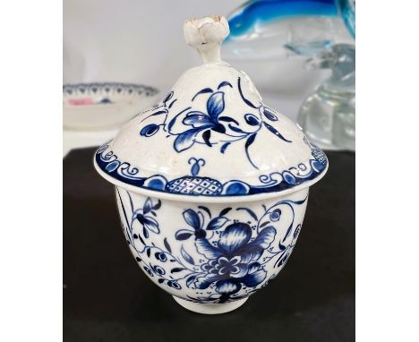 A First Period Worcester soft paste porcelain in blue and white lidded pot with floral decoration, and finial, crescent mark 