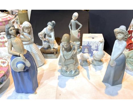 Lladro:Three figures of young girls and a Japanese lady flower arranging (flower a.f) and other Nao figures etc 