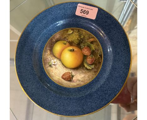 A Royal Worcester plate with wide powder blue border, the central panel hand painted with fruit in naturalistic setting, sign