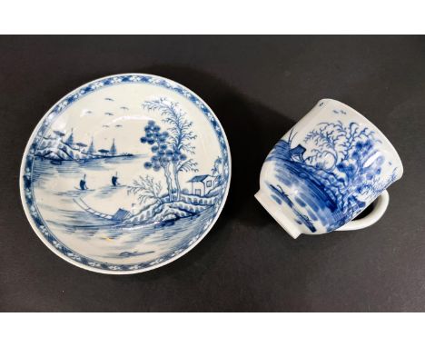 A First Period Worcester soft paste porcelain in blue and white cup and saucer traditional scene, crescent mark to base&nbsp;