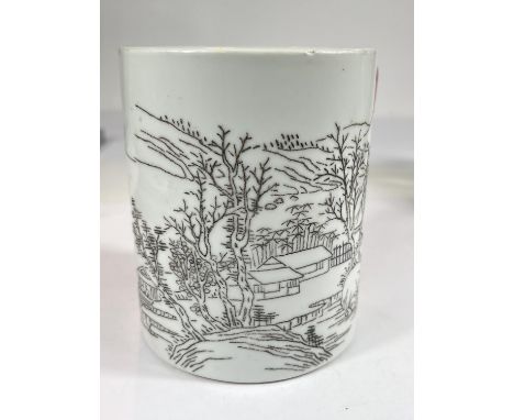 A Chinese ceramic cylindrical brush pot with monochrome sgraffito style decoration depicting houses in a landscape setting, r