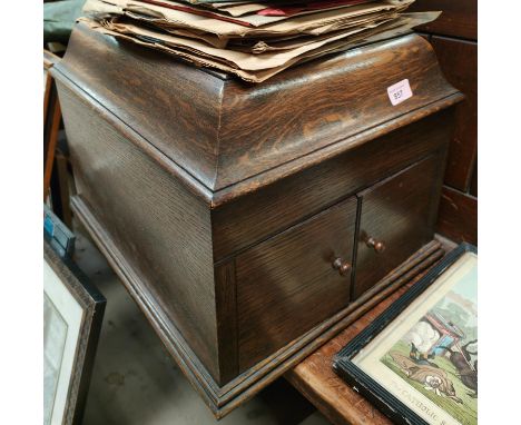 An oak cased HMV record player on Japanese bamboo; lacquered stand/magazine rack. 