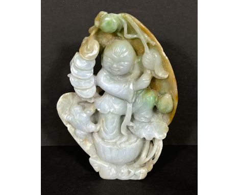 A Chinese carving in jade coloured hardstone depicting a man holding a branch, with shells to rear, height 10cm (chip to bran