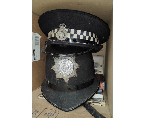 A 'police Helmet'; a police Cheshire Constable flat cap and two books. 