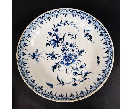 A First Period Worcester soft paste porcelain in blue and white dish with floral decoration, crescent moon mark to base, diam