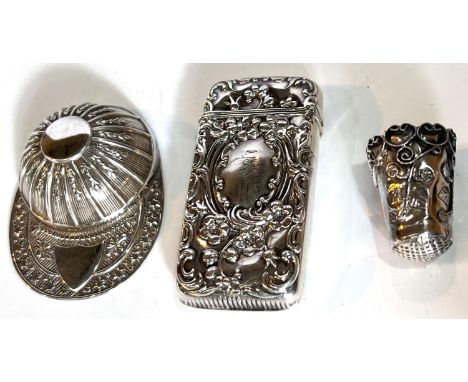 A hallmarked silver novelty caddy spoon in the form of a jockey's cap, Sheffield; a rococo embossed vesta case, stamped 'ster