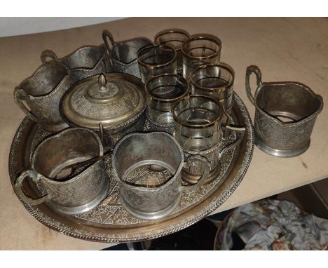 A Persian white metal tea and coffee service six of each cup with larger tray, (tea just sleeves no inner) a sugar pot lidded