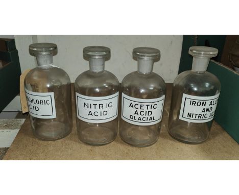 A set of vintage scientific glass storage jars with enamel labels 