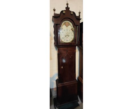 An early 19th century mahogany longcase clock by Thomas Barry, Bolton, the hood with brass finials and paterae, blind swan ne