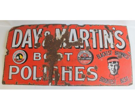 AN ANTIQUE ENAMEL SIGN ADVERTISING 'DAY AND MARTINS BOOT POLISH', white on red pictorial type. 61cm by 122cm 