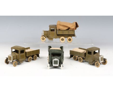 A Britains army 10-wheel tender, khaki, with driver, another 10-wheel tender, dark green, and two army six-wheel tipper lorri