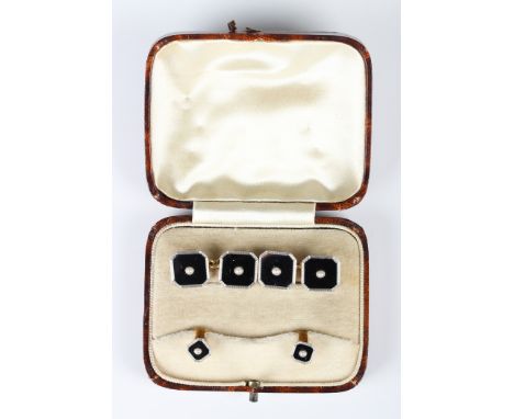 A pair of gold and platinum, black onyx and seed pearl cut cornered square dress cufflinks, each black onyx panel centred by 