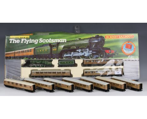 A Hornby Railways gauge OO R.869 The Flying Scotsman train set, boxed, and twelve LNER 'teak' coaches.Buyer’s Premium 29.4% (