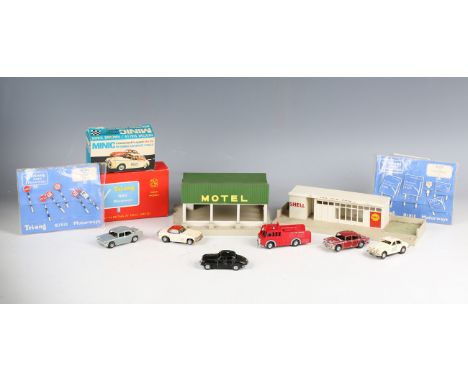 A collection of Tri-ang Minic Motorways, including an M.1550 fire engine, a Jaguar police car, two other cars, track and trac