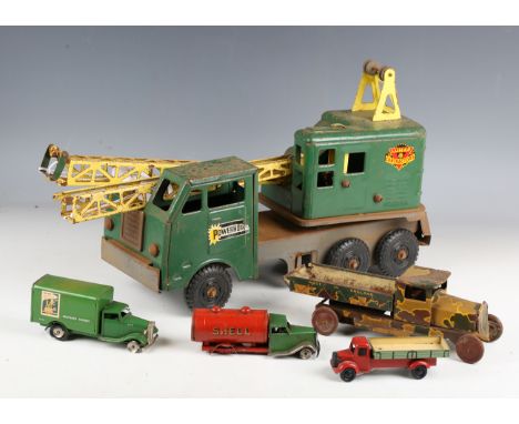 A collection of tinplate and mechanical toys, including a Tri-ang Minic No. 79m delivery van, a Minic tanker, a Wells Brimtoy