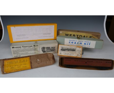 A small collection of gauge OO coach kits, including a Modern Traction Kits Gresley buffet car, a Westdale Scale Model coach 