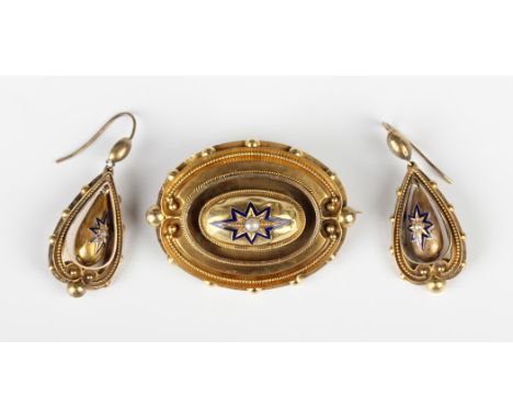 A Victorian gold, half-pearl and blue enamelled oval brooch with applied bead and wirework decoration, the back glazed with a