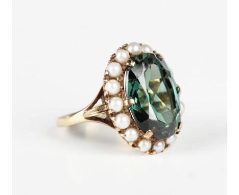 A 9ct gold, synthetic green spinel and cultured pearl oval cluster ring, London 1959, weight 6.5g, ring size approx K.Buyer’s