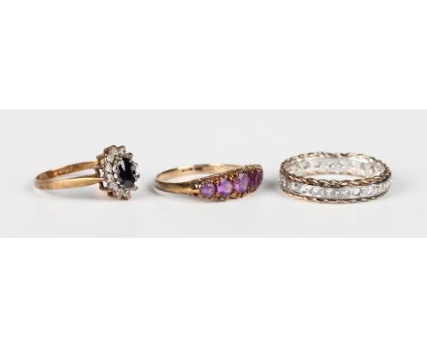 A 9ct gold and amethyst five stone ring, mounted with a row of graduated circular cut amethysts, ring size approx L1/2, a 9ct