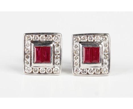 A pair of white gold, ruby and diamond rectangular cluster earstuds, each collet set with two baguette cut rubies within a su
