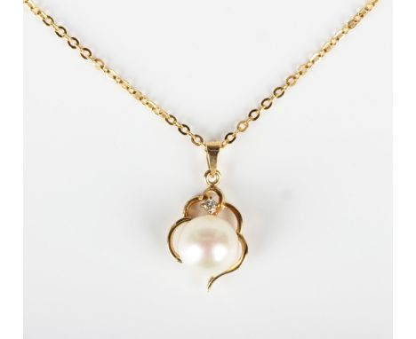 A gold, cultured pearl and diamond pendant, detailed '585 14K', length 1.9cm, with a gold neckchain, detailed '585', on a bol