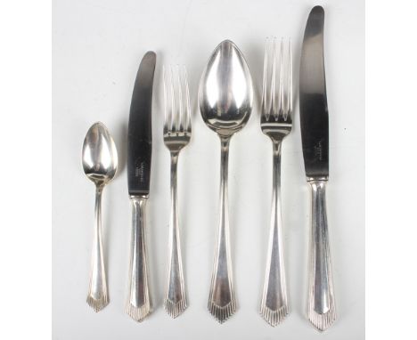 An Art Deco Austrian canteen of .800 silver cutlery with tapering reeded handles, comprising eleven table knives, twelve tabl