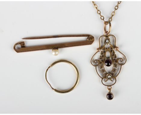 An Edwardian gold, amethyst and half-pearl pendant in an openwork design, detailed '9ct', weight 1.2g, length 3.8cm, on a gil