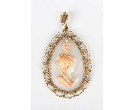 A gold and shell cameo drop shaped pendant, carved as a portrait of a lady within a beaded and wirework surround, detailed '1