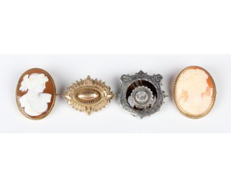 A 9ct gold mounted oval shell cameo brooch, carved with a portrait of a lady, London 1977, width 3cm, another gold mounted ov