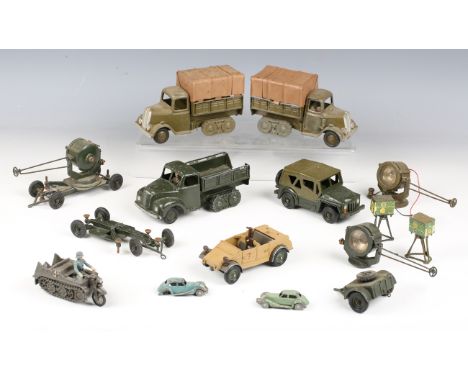 Three Britains army half-track trucks (two with canopies), an Austin Champ, four searchlights, a Kubelwagen limber, a Kettenk