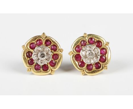 A pair of gold, diamond and ruby earstuds, each designed as a Tudor rose, with post and butterfly fittings, the butterflies d