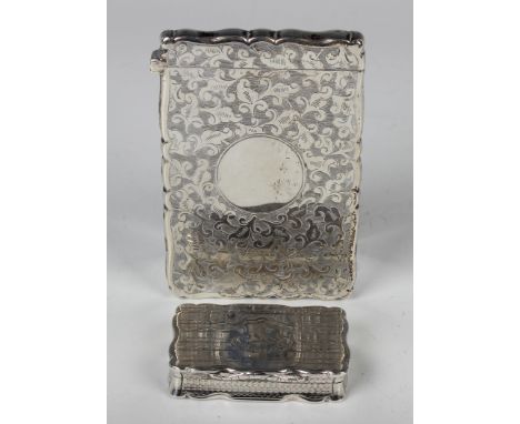 A Victorian silver shaped rectangular engine turned snuff box, the hinged lid with engraved crest, Birmingham 1845 by Nathani