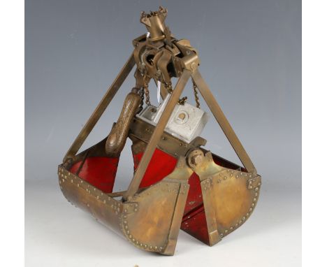 A brass working model of a Barnard excavator grab by W.M. Goodacre &amp; Sons Ltd, with applied label and red painted interio