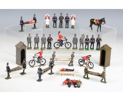 A collection of Britains and other lead figures, including Royal Army Medical Corps, patients, nurses and cyclists.Buyer’s Pr