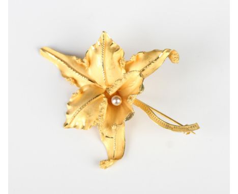 A gold and imitation pearl brooch, designed as an orchid, detailed '18K', weight 13.5g, width 7.4cm.Buyer’s Premium 29.4% (in
