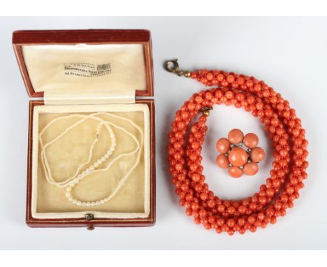 A coral bead necklace, gross weight 29.1g, length 40cm, a coral bead and seed pearl circular brooch and a row of graduated se