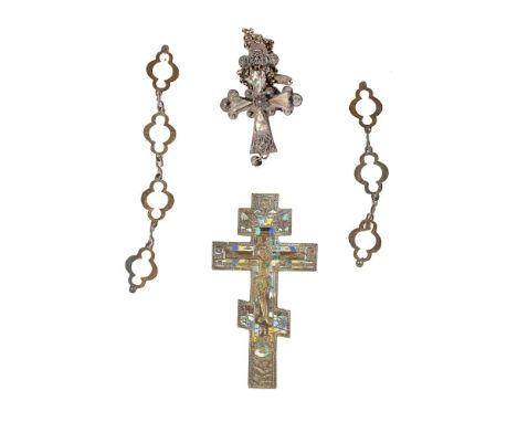 
	
		A late 19th century Russian bronzed and enamel crucifix, of three bar Orthodox form, 19.5cm high; and a silvered cross, 