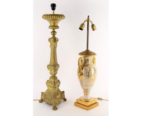 
	
		A large ceramic table lamp in the Paris style, twin lights above body with twin stylised dolphin handles, all over flora