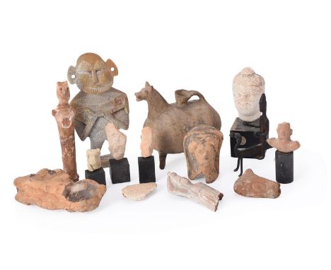 
	
		A miscellaneous group of antiquities and later objects, including seven Cypriot terracotta heads and busts of votive fig