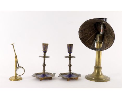 
	
		A pair of brass and niello Indo-Persian candlesticks, late 19th /early 20th century, blue and red enamel 16.5cm high; an