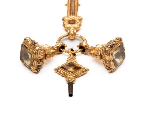 18 kt. gouden horlogeketting, ca. 1850. Bestaande uit een dubbele schakel waartussen een schuifje. De ring aan de onderzijde 