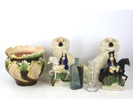 A group of 19th century English pottery. Including a pair of Staffordshire dogs, two flat back figures of highway men and a m