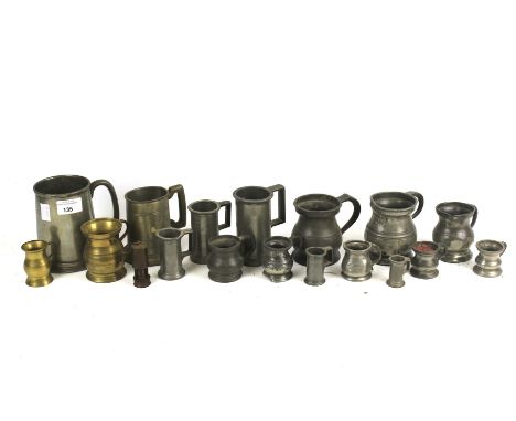 A collection of assorted vintage pewter tankards and measures. (17) 