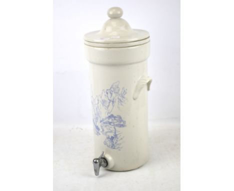 A water purifier. Of ceramic construction white with blue floral detailing, H47cm. 