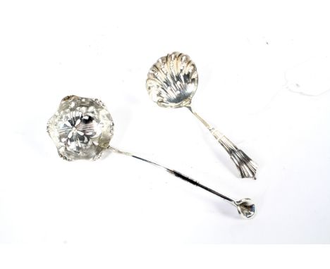 A silver sugar sifter ladle with shell shaped bowl. Maker James Deakin &amp; Sons, Sheffield 1900, 17.2 grams, together with 