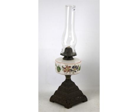 Victorian oil lamp. On brass base with floral design and glass shade, H52cm. 