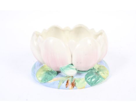 A Clarice cliff water lilly bowl. Of moulded form on a lily pad and water raised base. H12cm Condition Report: Restored chips